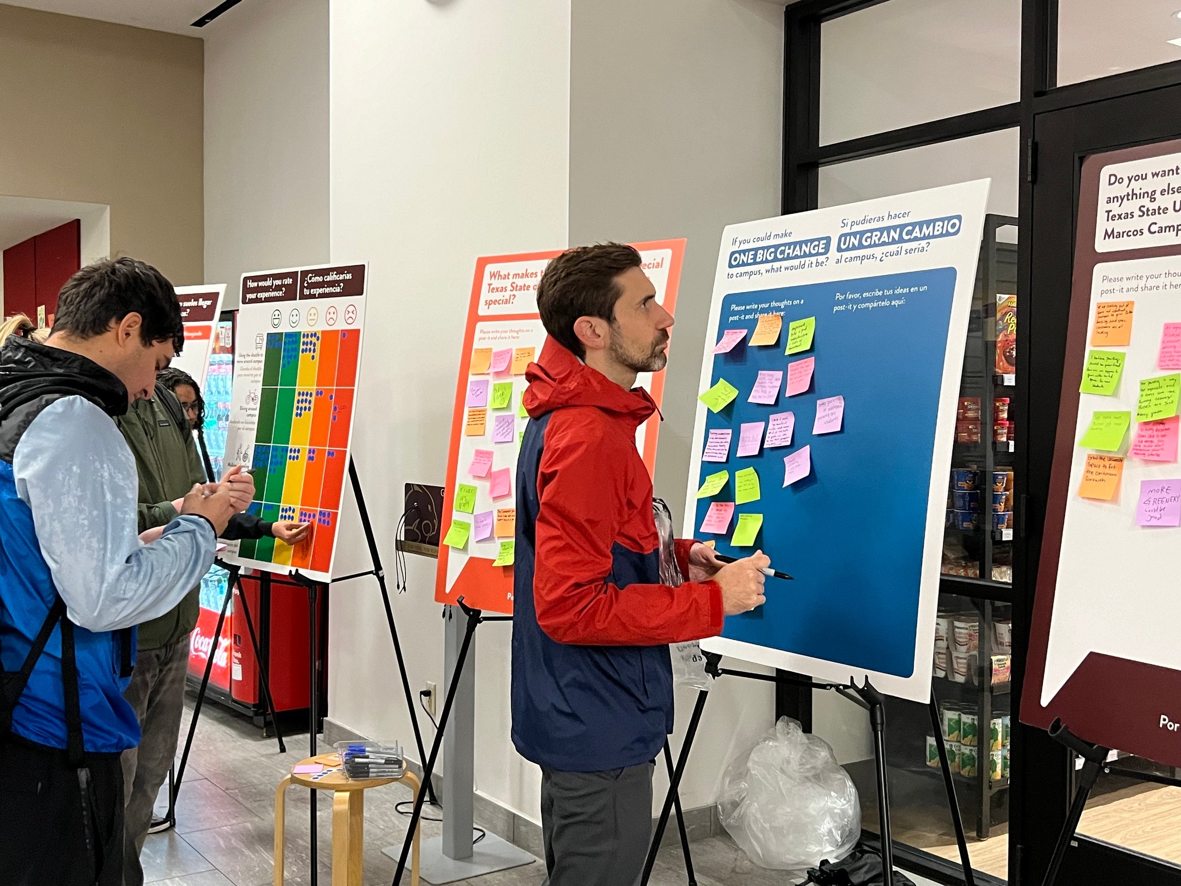 A person writes on a planning board