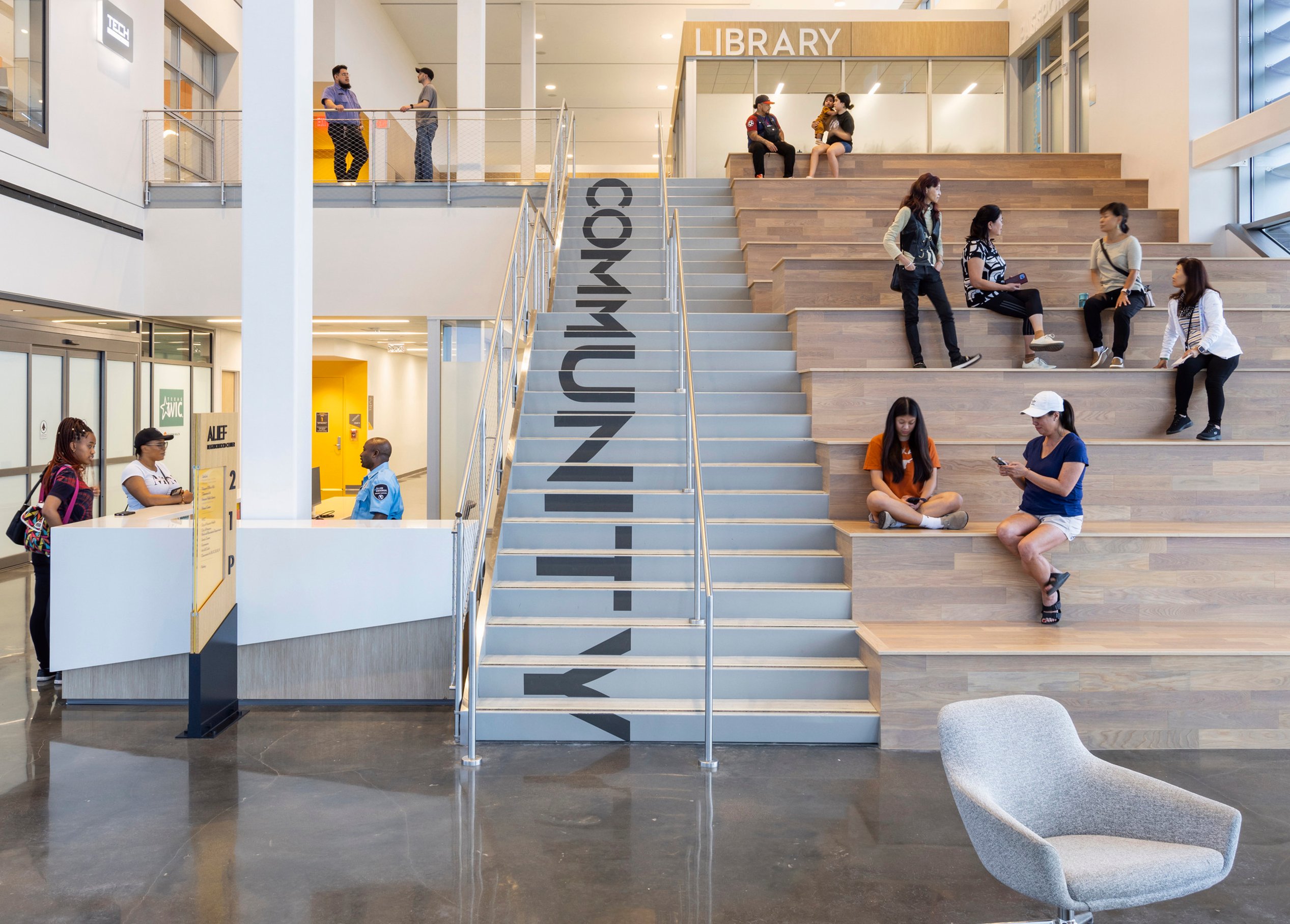 Inside, bold cascading letterforms flow down the central stairs, turning everyday movement into a dynamic visual experience. This feature fosters a sense of community, creating a focal point that welcomes and gathers people.