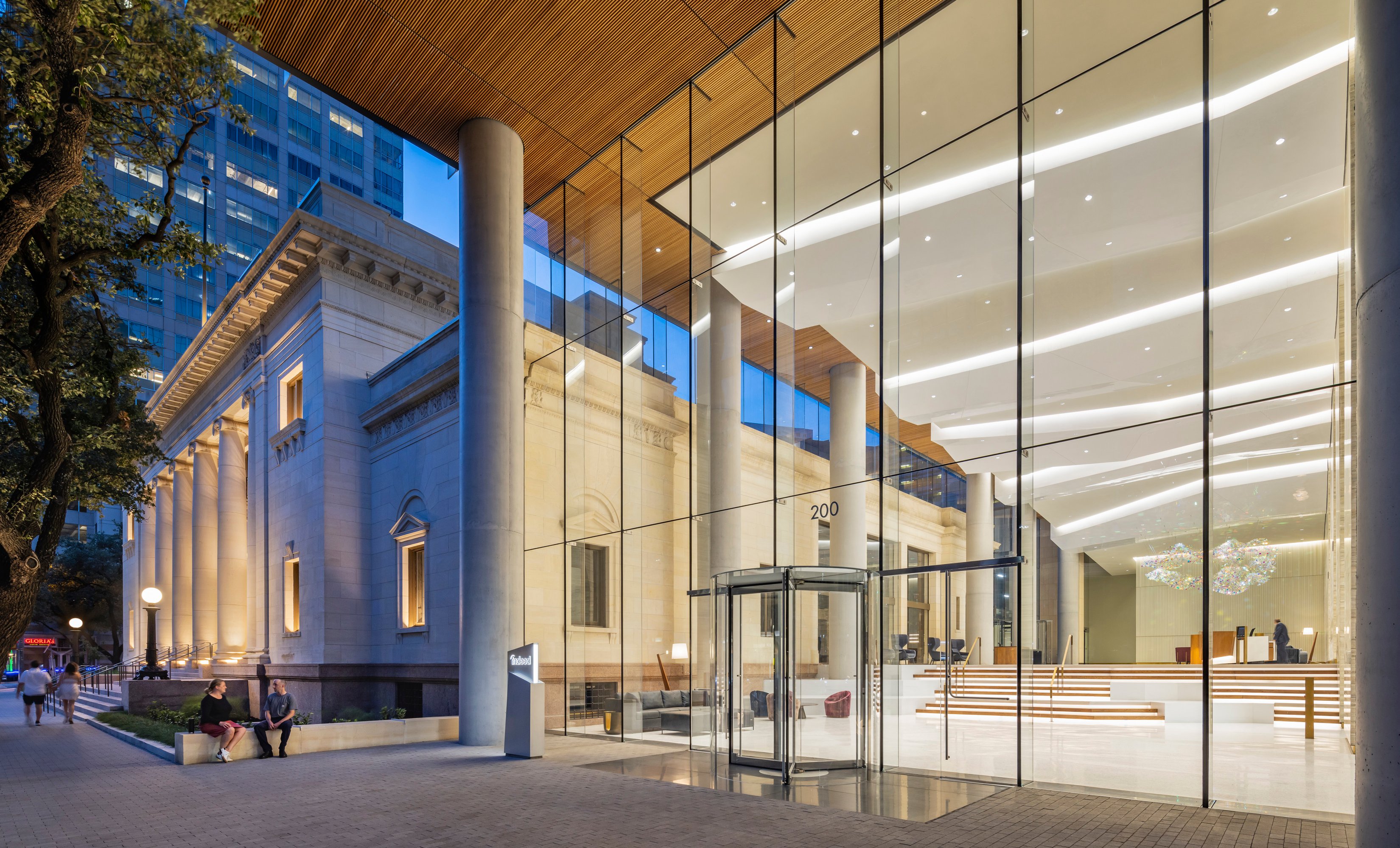Exterior entrance to building with large glass walls